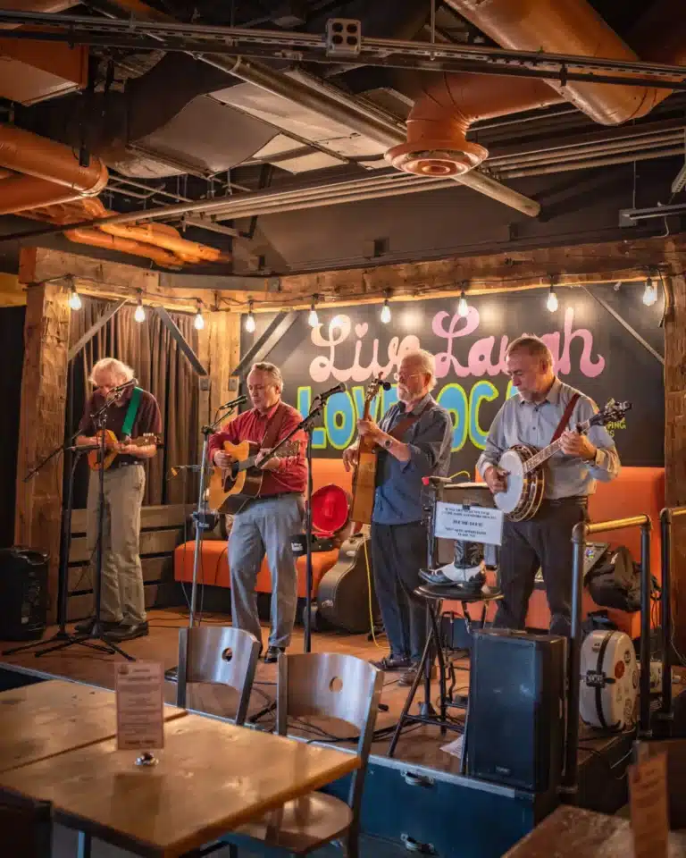 A band playing on the stage at The Skinny Pancake Burlington